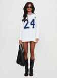 side view of model wearing Princess Polly Star Player Long Sleeve Top White Full Sleeves V-Neck 