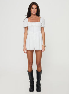 Romper Puff sleeve, square neckline, adjustable ruching at bust with tie fastening, invisible zip fastening down back Non-stretch material, partially lined Princess Polly Lower Impact