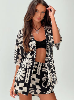 side view of model wearing Princess Polly Caraliia Shirt Black / Cream Three Fourth Sleeves V-Neck 