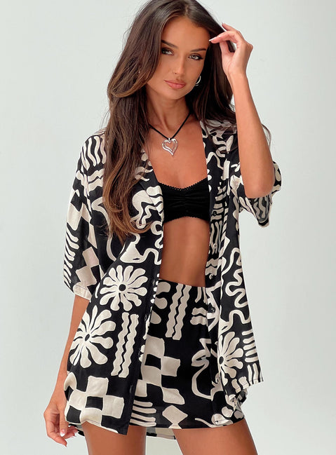 side view of model wearing Princess Polly Caraliia Shirt Black / Cream Three Fourth Sleeves V-Neck 