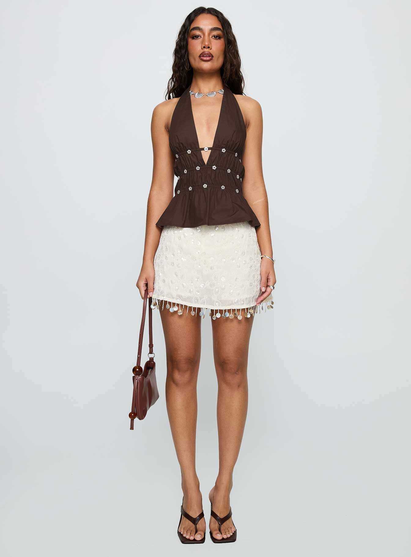 front view of model wearing Princess Polly Movies End Halter Top Brown Sleeveless Plunger 