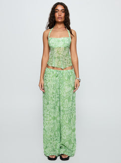 side view of model wearing Princess Polly Finesse Pants Green Floral High Waisted Pants 
