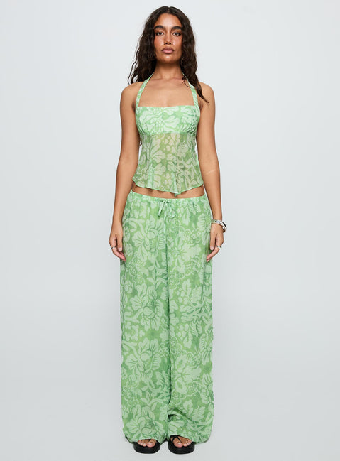 side view of model wearing Princess Polly Finesse Pants Green Floral High Waisted Pants 