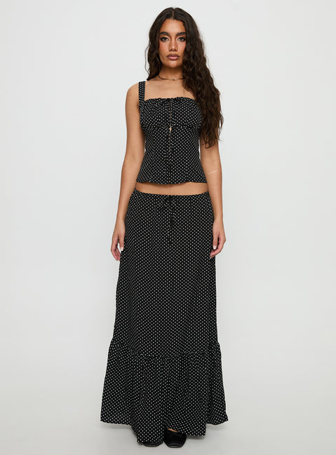   side view of model wearing Princess Polly Modern Girl Maxi Skirt Black / Polka Dot 