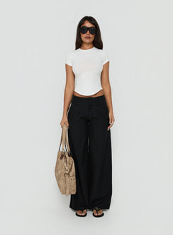 Featuring Loved Up Low Rise Baggy Pants Black in womens regular pants front view of model wearing Princess Polly