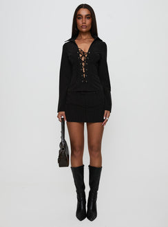 side view of model wearing Princess Polly Feminique Tie Up Long Sleeve Top Black Stripe Full Sleeves Plunger 