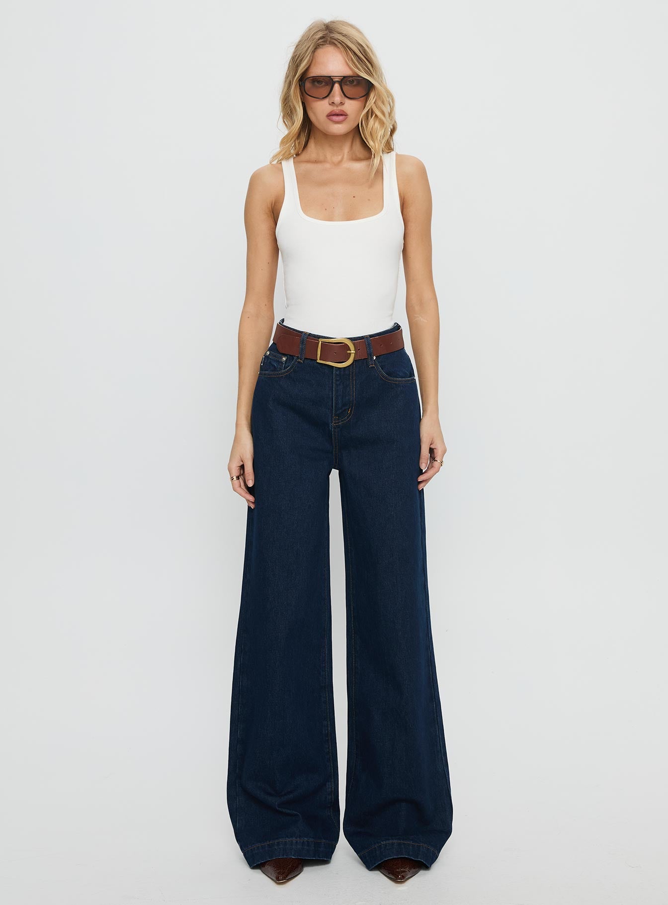 front view of model wearing Princess Polly Goldie High Rise Wide Leg Jeans Indigo High Rise Jeans 