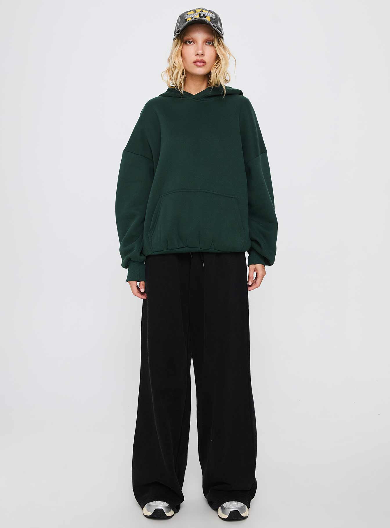 front view of model wearing Princess Polly Good Luck Graphic Hoodie Green / Blue Long 