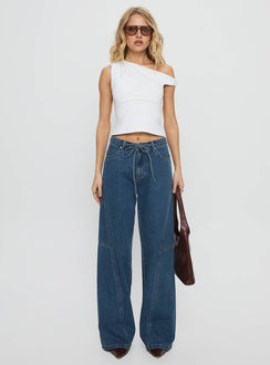front view of model wearing Princess Polly Bruiser Mid Rise Wide Leg Jeans Mid Blue Wash Mid Rise Jeans 
