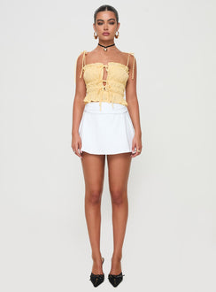 front view of model wearing Princess Polly Reema Skort White High Waisted Shorts 