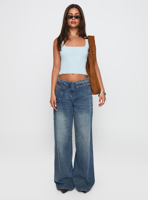 side view of model wearing Princess Polly Paltrow Mid Rise Wide Leg Cargo Jeans Mid Blue Wash Petite Mid Rise Jeans 