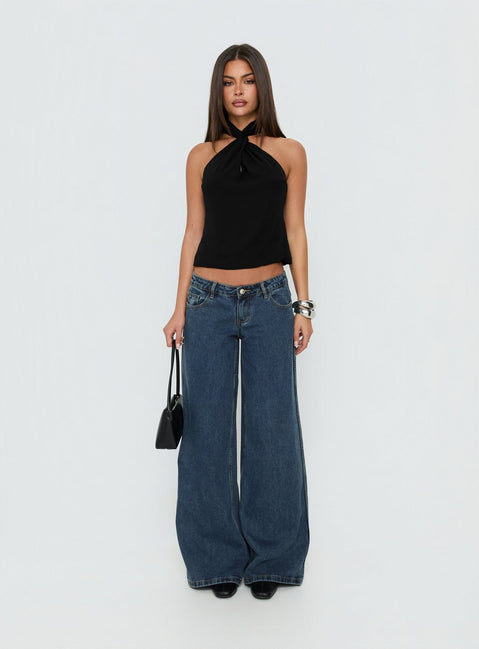 Showcasing Picco Ultra Low Rise Wide Leg Jeans in womens-jeans with dark blue wash front view of model wearing Princess Polly