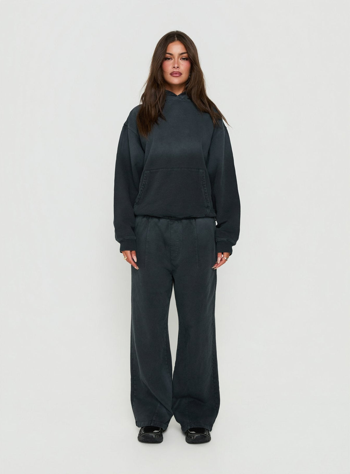 Crafted from black Baggy Sweatpant in womens regular pants with wide-leg mid-rise design front view of model wearing Princess Polly