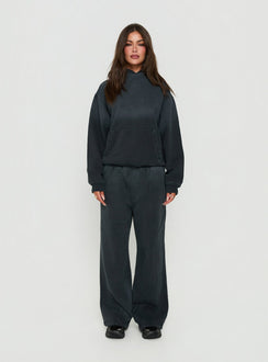 Crafted from black Baggy Sweatpant in womens regular pants with wide-leg mid-rise design front view of model wearing Princess Polly