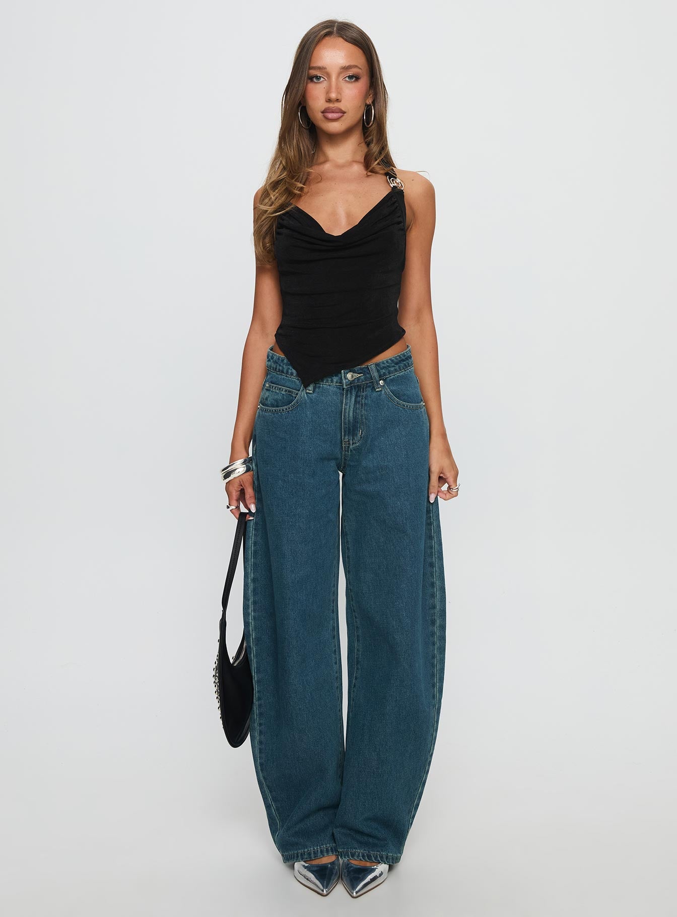 front view of model wearing Princess Polly Juda Mid Rise Barrel Leg Jeans Mid Blue Wash High Waisted Jeans 