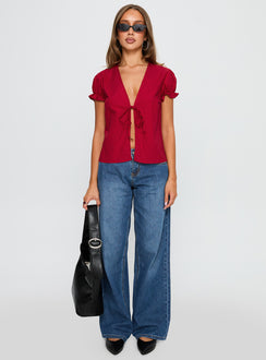 front view of model wearing Princess Polly Starstruck Tie Up Top Red Short Sleeves V-Neck 