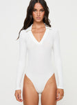 front view of model wearing Princess Polly Tarpley Long Sleeve Bodysuit White Full Sleeves V-Neck 