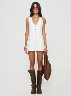 Romper Fixed shoulder straps, scooped neckline, button fastening down front Non-stretch material, unlined 