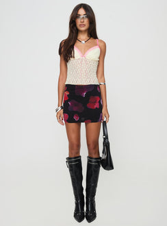   front view of model wearing Princess Polly Kennith Mini Skirt Black / Red Floral 