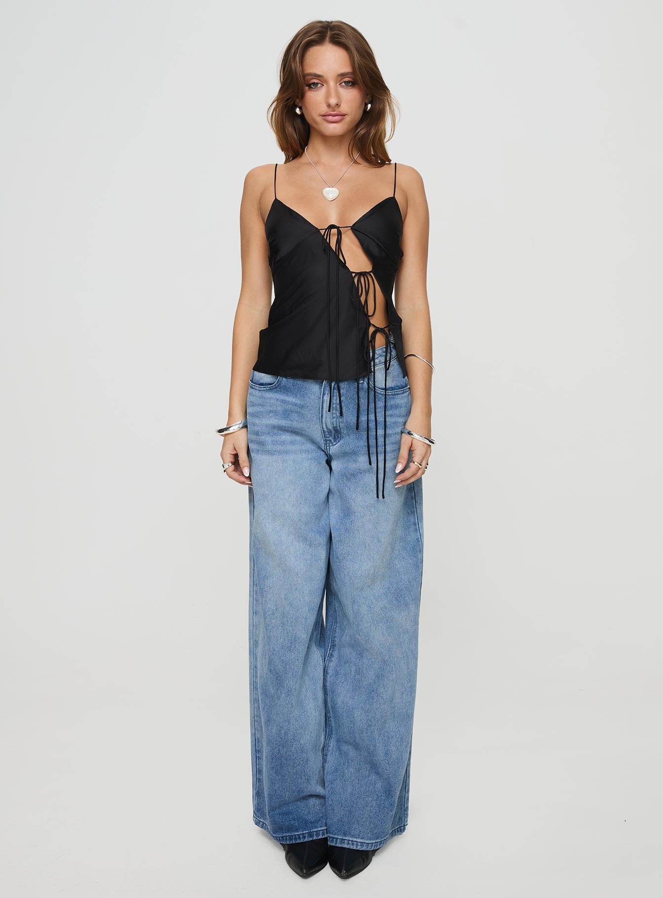 front view of model wearing Princess Polly Mariah Cami Top Black Sleeveless Plunger 