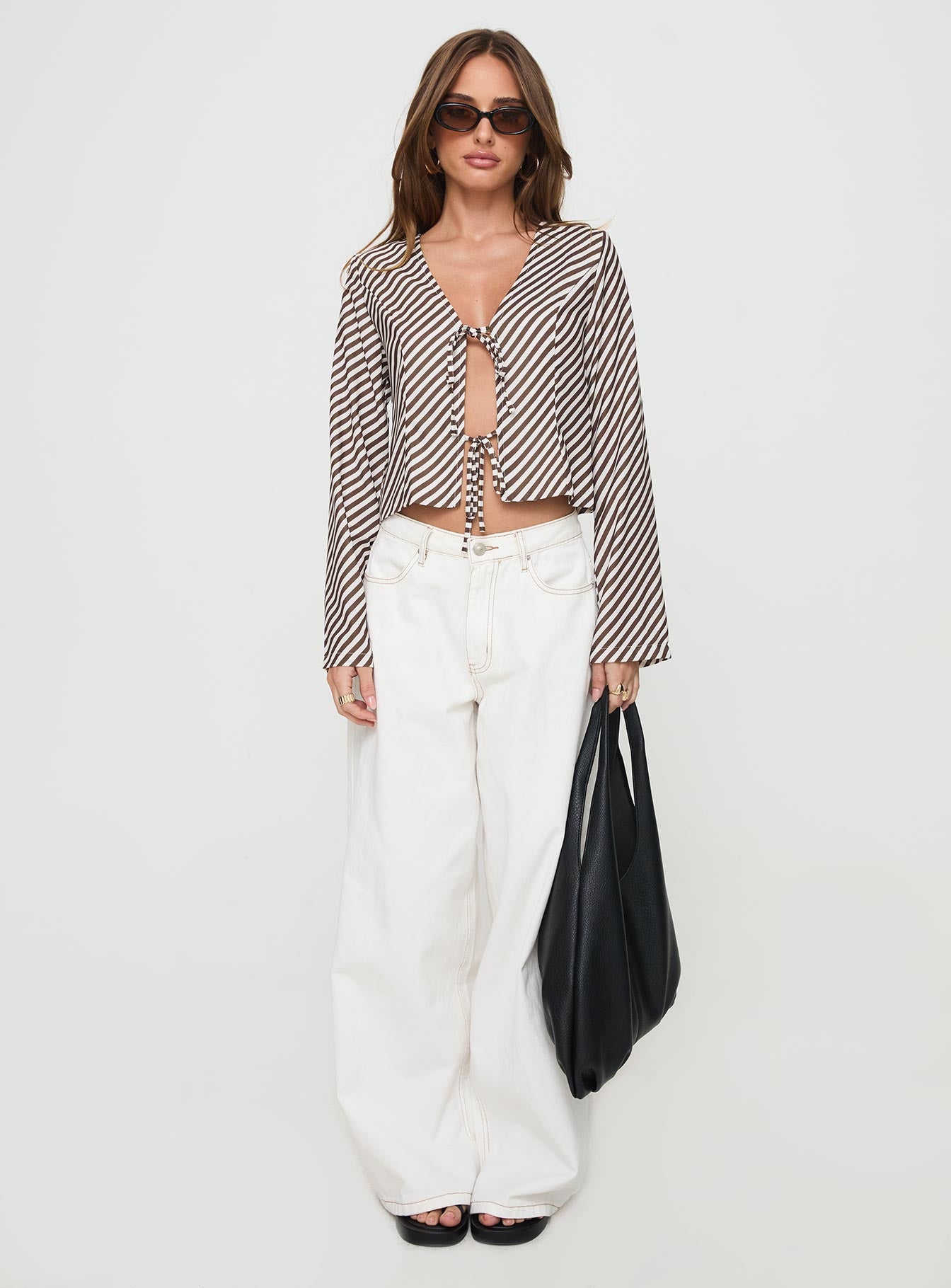 front view of model wearing Princess Polly Maxette Long Sleeve Tie Top Brown Stripe Full Sleeves V-Neck 