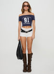 front view of model wearing Princess Polly Serendipia Off The Shoulder Graphic Top Navy Short Sleeves straight 