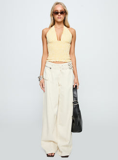 side view of model wearing Princess Polly Averin Shirred Halter Top Lemon Stripe Sleeveless Plunger 