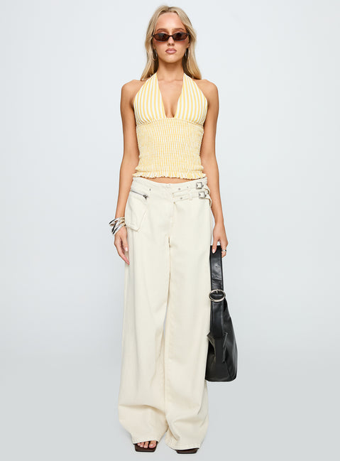 side view of model wearing Princess Polly Averin Shirred Halter Top Lemon Stripe Sleeveless Plunger 