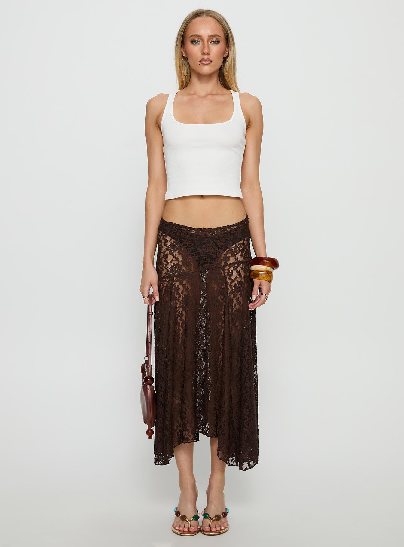   side view of model wearing Princess Polly Tidal Midi Skirt Chocolate 