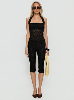 front view of model wearing Princess Polly Babydoll Capri Pants Noir Mid Rise Pants 