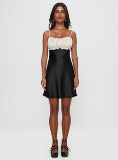 side view of model wearing Princess Polly Cacciatore Mini Dress Black / Cream Sweetheart Neckline 