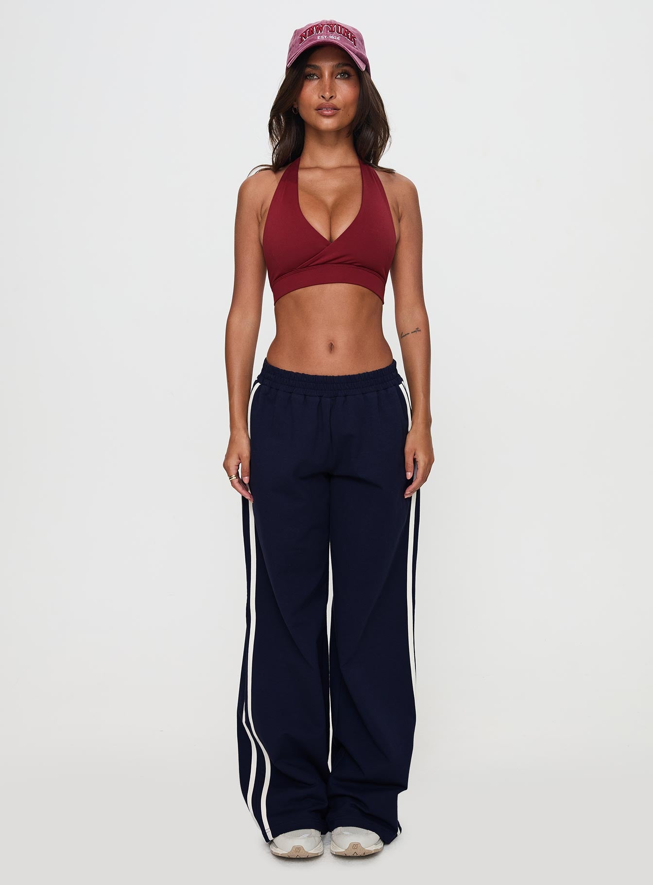 side view of model wearing Princess Polly Circuit Track Pants Navy 