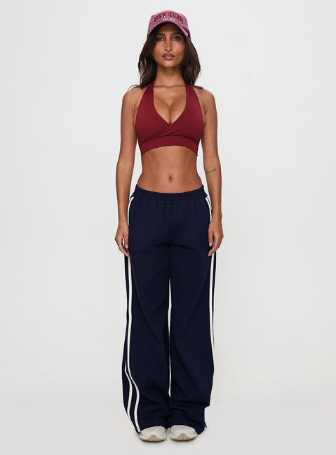 side view of model wearing Princess Polly Circuit Track Pants Navy 
