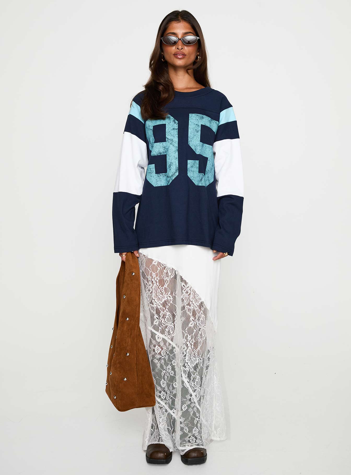 front view of model wearing Princess Polly Collegiate Queen Long Sleeved Top Navy Full Sleeves Crew Neck 