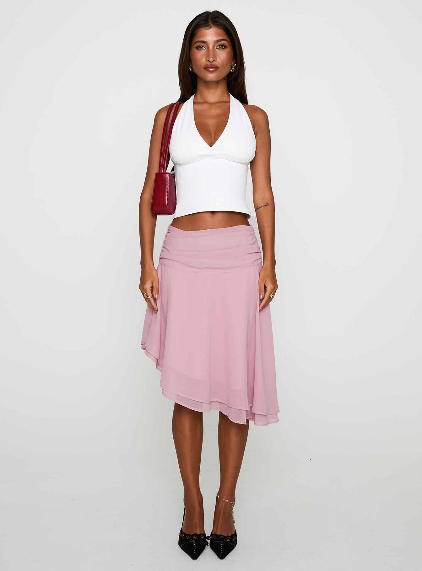   front view of model wearing Princess Polly Evanescence Asymmetrical Midi Skirt Pastel Pink Midi Skirts 