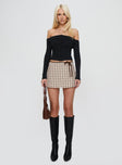 front view of model wearing Princess Polly Korren Low Rise Skort Plaid Tall 