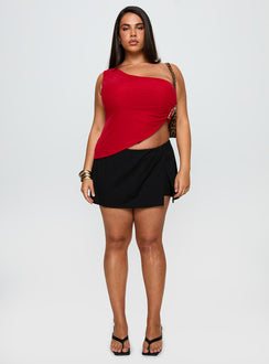 side view of model wearing Princess Polly Machiatto One Shoulder Top Red Curve Sleeveless Asymmetric Neckline 