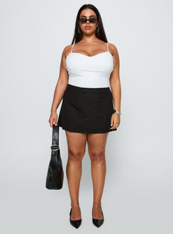 front view of model wearing Princess Polly Feminique Skort Black Stripe Curve High Waisted Shorts 