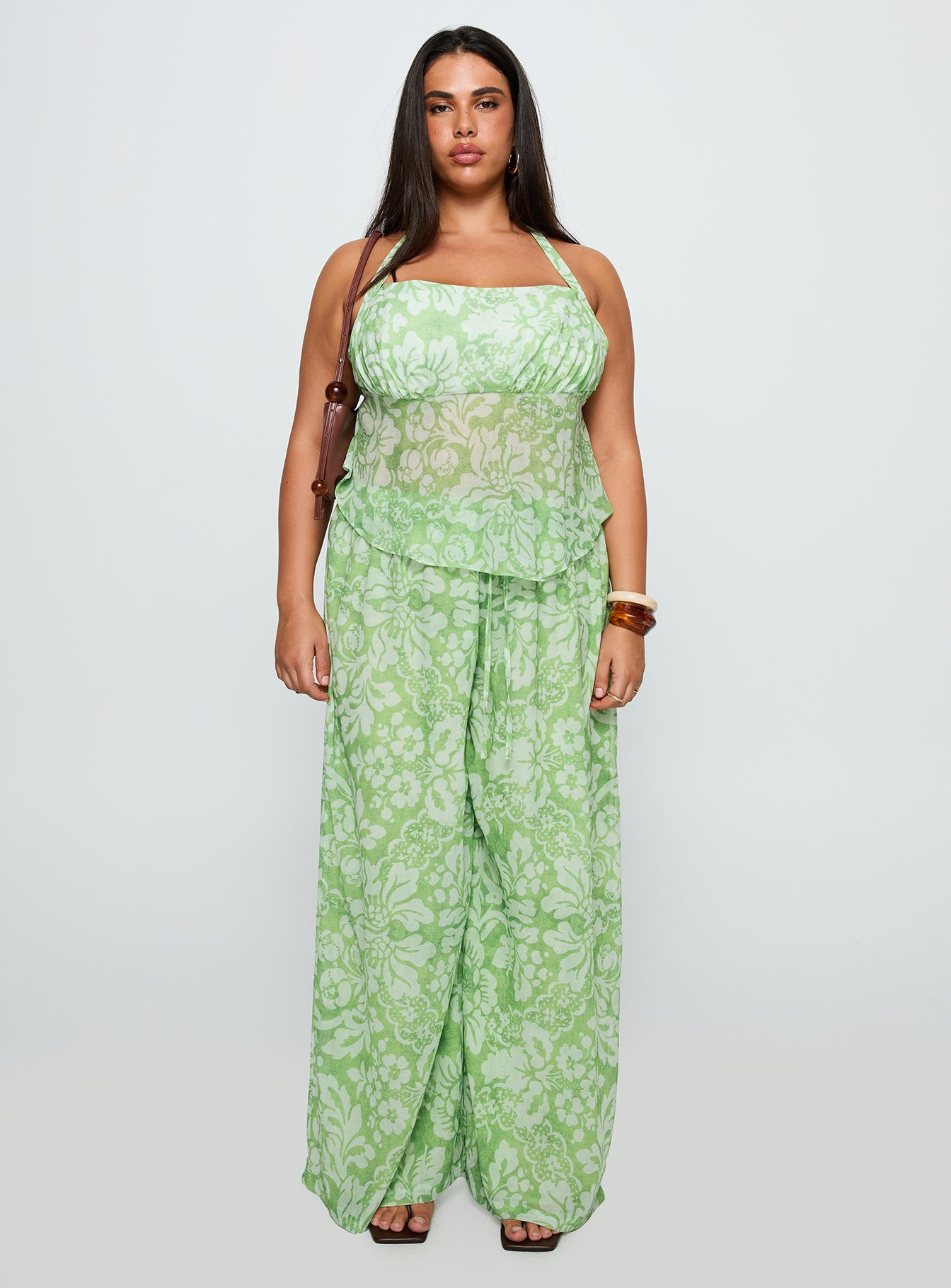 back view of model wearing Princess Polly Finesse Pants Green Floral Curve High Waisted Pants 