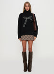 side view of model wearing Princess Polly Shes So Sweet Bow Knit Sweater Black 