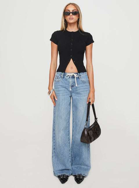 side view of model wearing Princess Polly Suzu Top Black Short Sleeves High Neck 