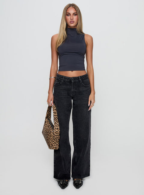 front view of model wearing Princess Polly Serenitia Mid Rise Relaxed Jeans Washed Black Petite Mid Rise 