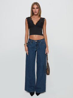 front view of model wearing Princess Polly Ramos Low Rise Denim Jeans Dark Blue Wash Low Rise Jeans 