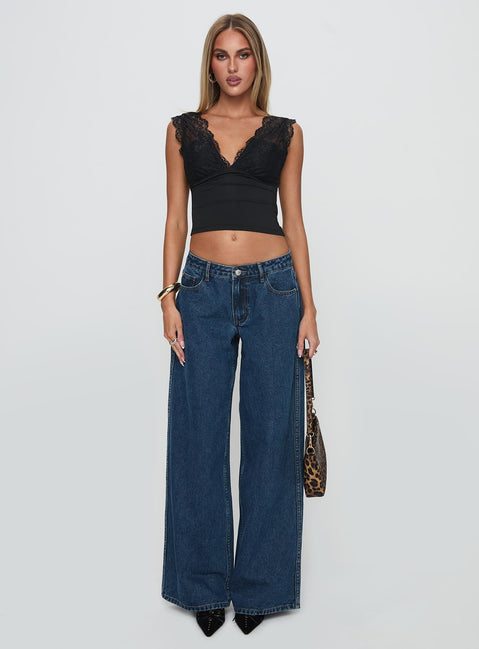 front view of model wearing Princess Polly Ramos Low Rise Denim Jeans Dark Blue Wash Low Rise Jeans 