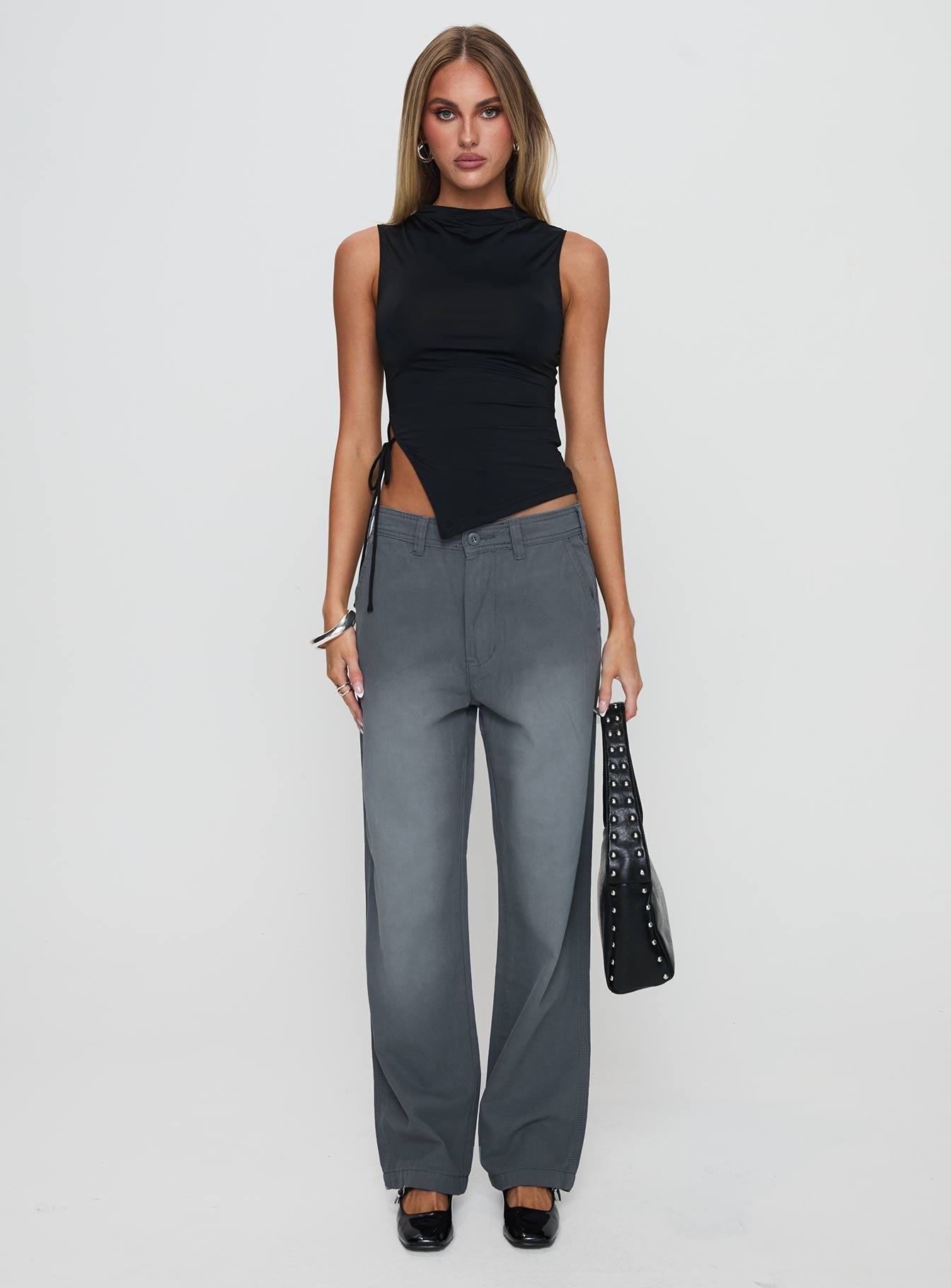 front view of model wearing Princess Polly Solarah Tie Side Top Black Sleeveless High Neck 