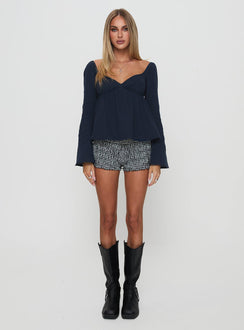 side view of model wearing Princess Polly Khalea Long Sleeve Top Navy Full Sleeves V-Neck 