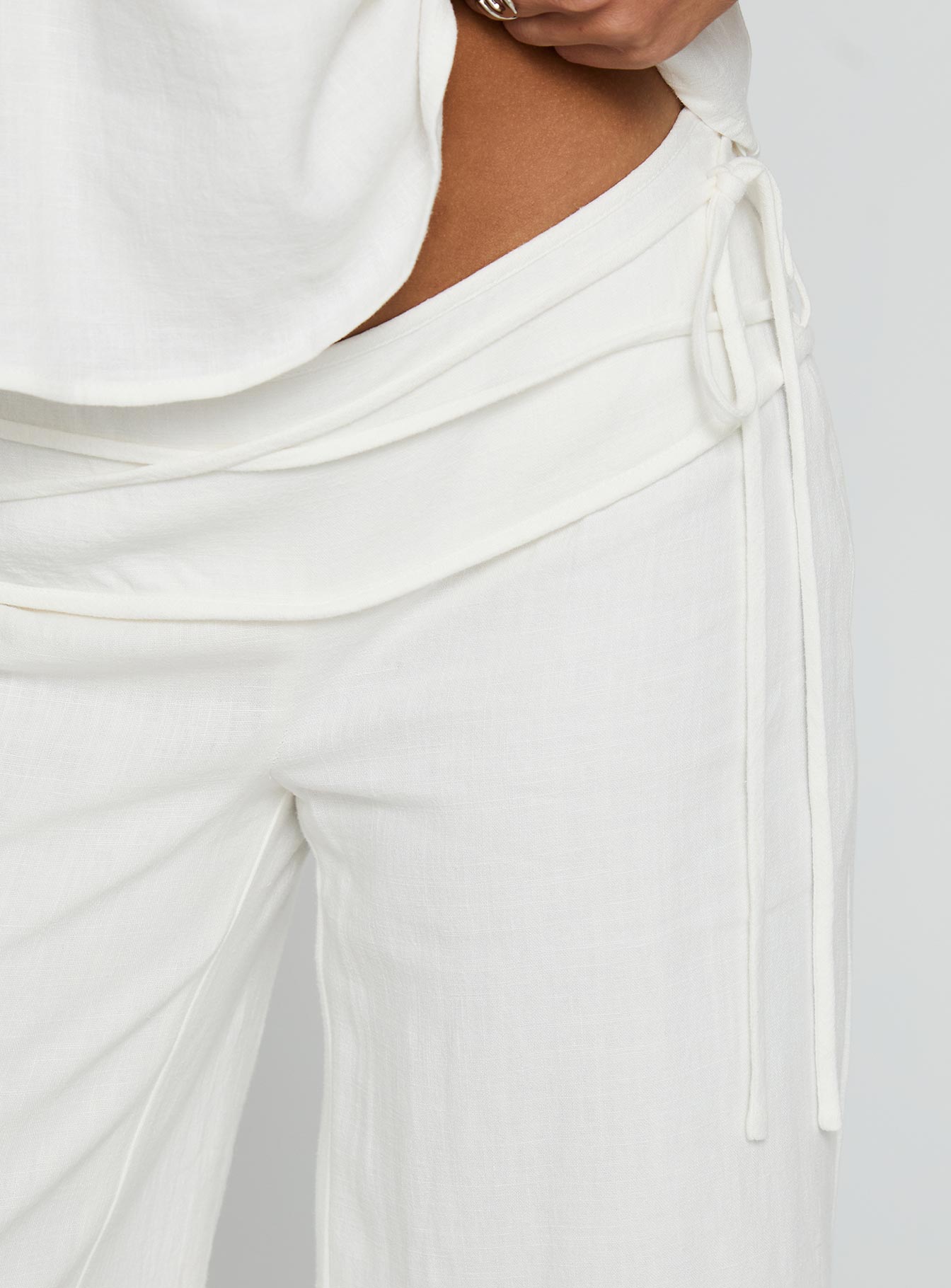 Showcasing Silver Moon Linen Blend Tie Pants White Petite womens regular pants with high-rise detail view of model wearing