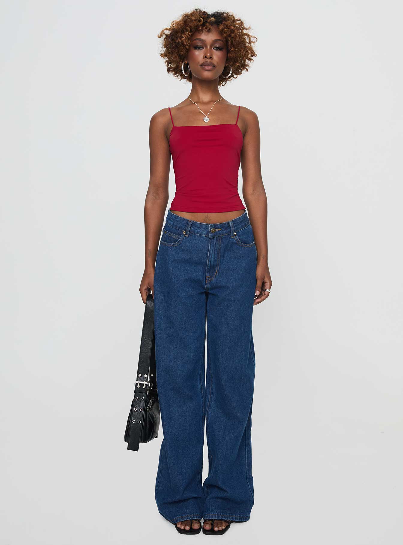 side view of model wearing Princess Polly Elissa Top Red Sleeveless Square Neck 