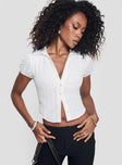 Shirt Classic collar, button fastening, puffed sleeves, ruched bust detail Non-stretch material, unlined 