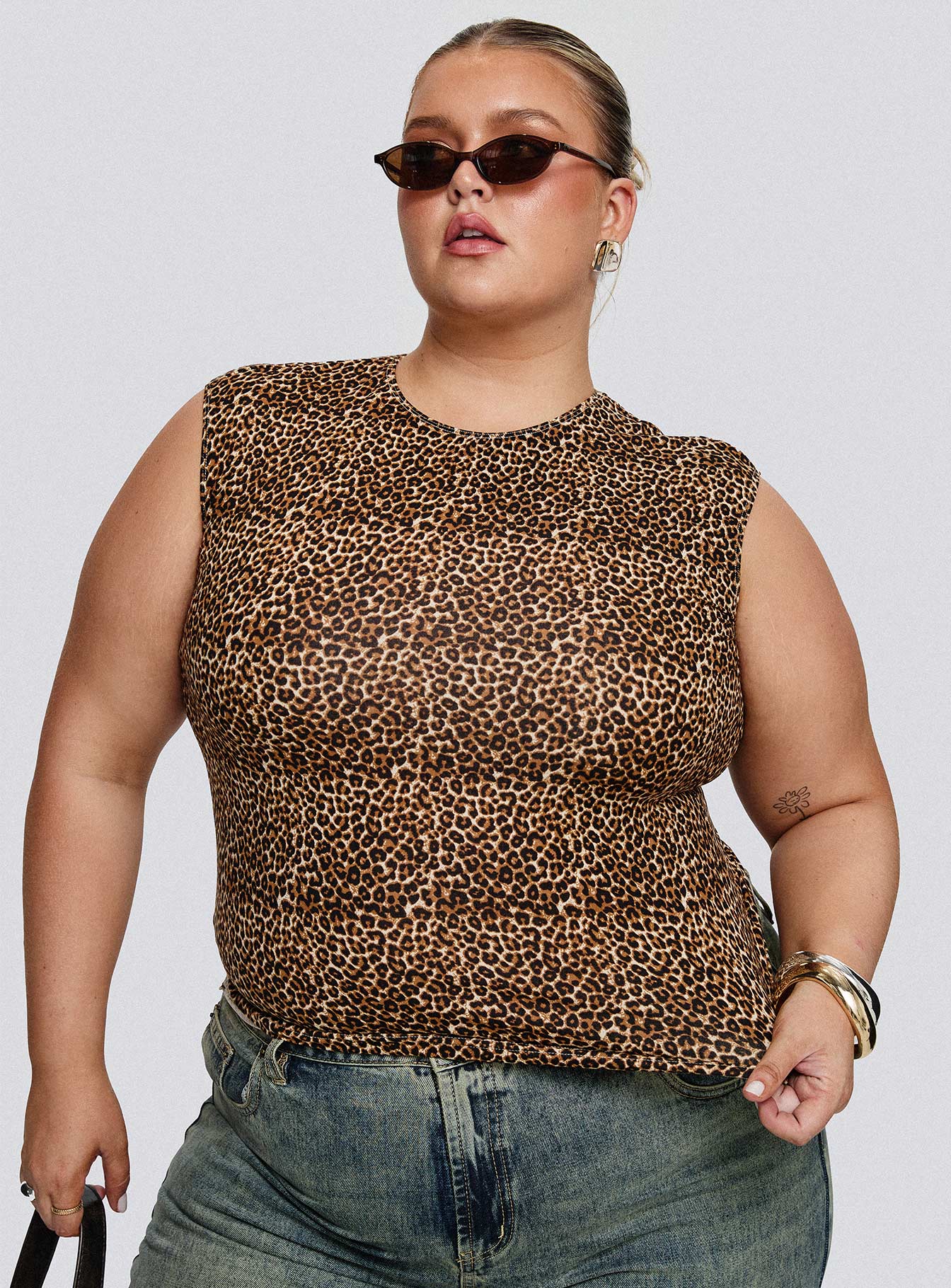front view of model wearing Princess Polly Lure Top Leopard Curve Sleeveless Crew Neck 